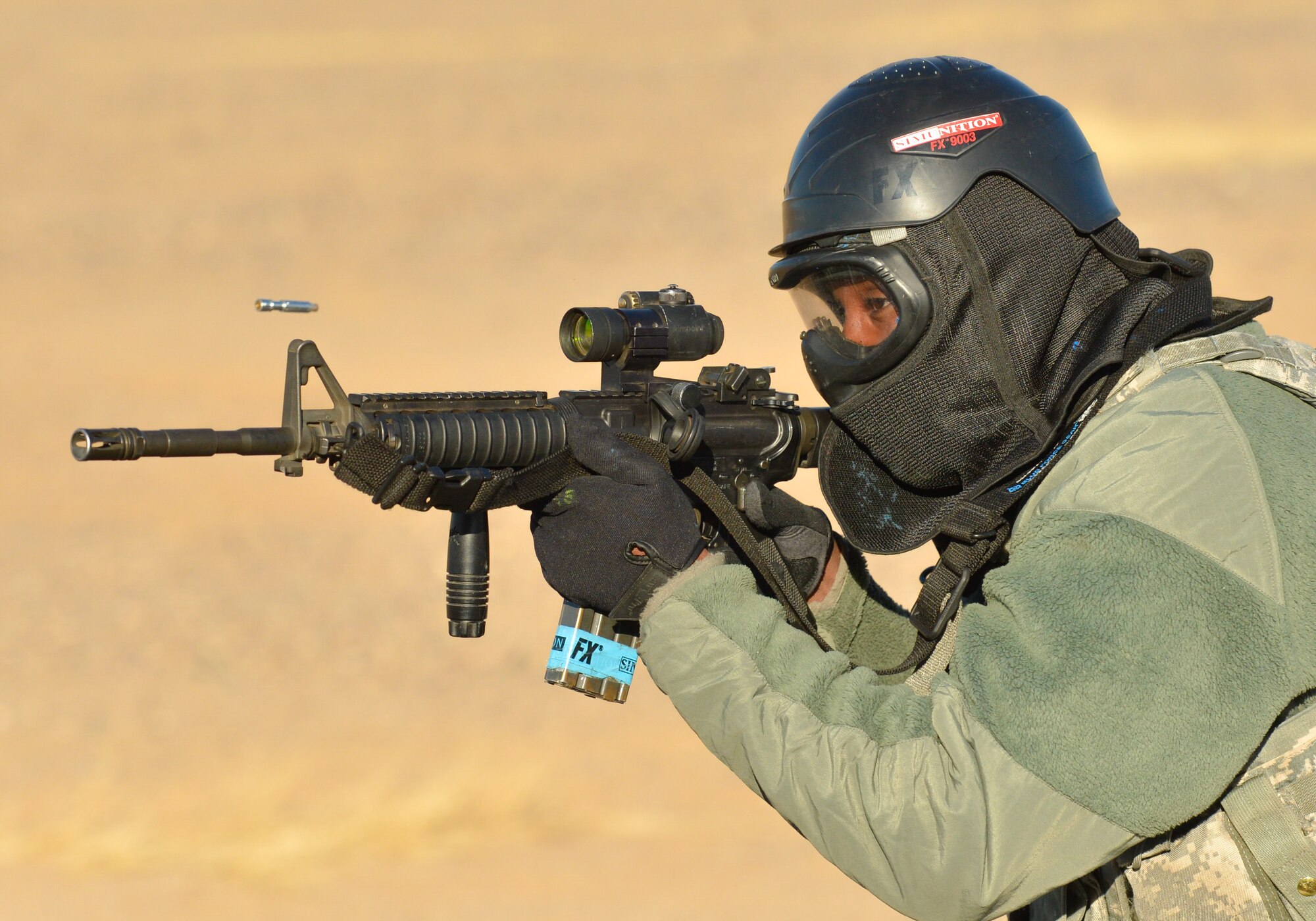 An Airman from the 56th Contracting Squadron fires an M-4 rifle at opposing forces during an exercise Feb. 23, 2018, at Luke Air Force Base, Ariz. The exercise tested their contracting skills in a high stress environment. (U.S. Air Force photo by Airman 1st Class Caleb Worpel)