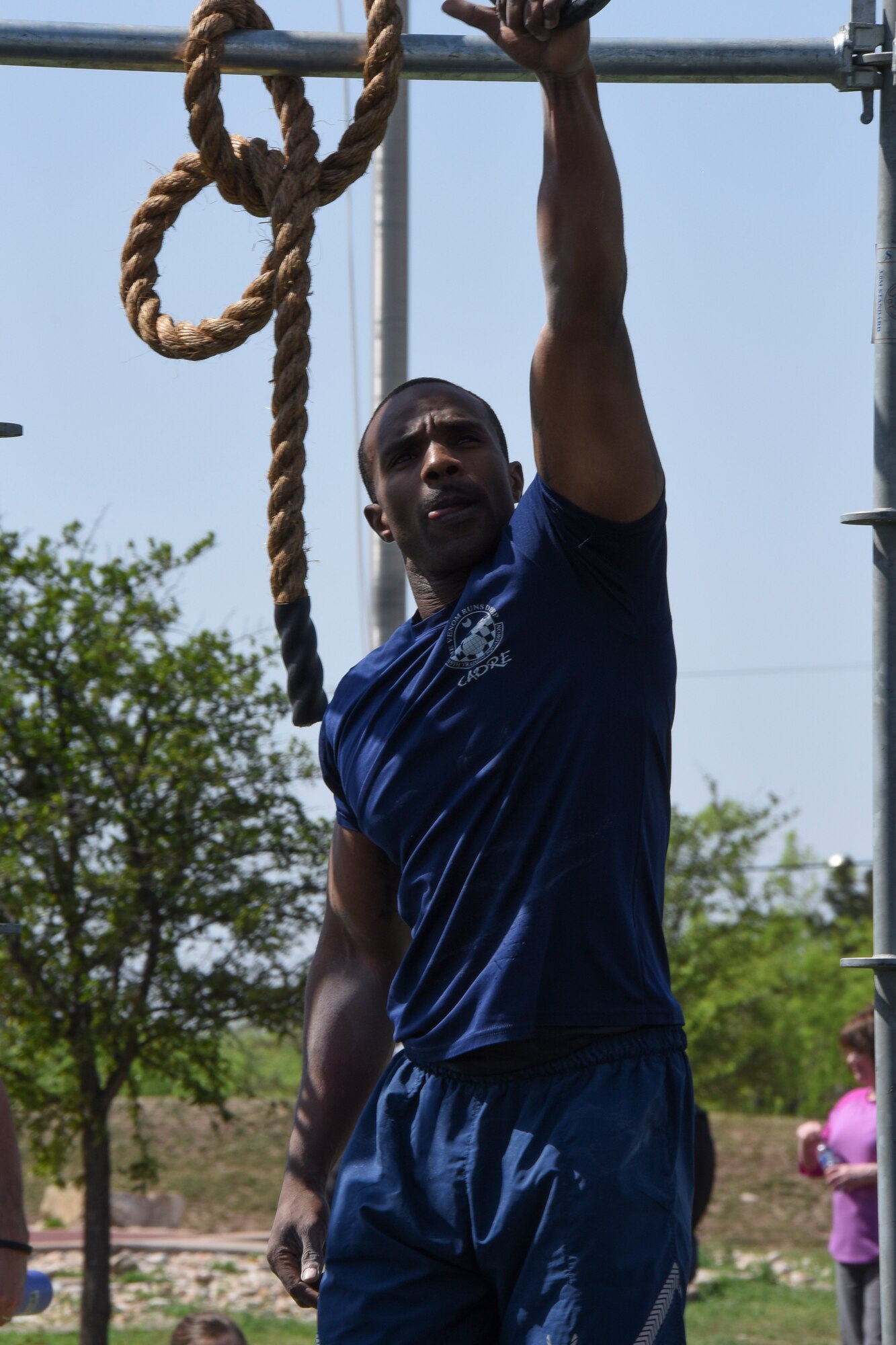 Master Sgt. Jamaal Chesney swings through the Alpha Warrior "Battle Rig" during Sports Day on Goodfellow Air Force Base, Texas, April 13, 2018. Chesney was later awarded 1st place for the Alpha Warrior competition.