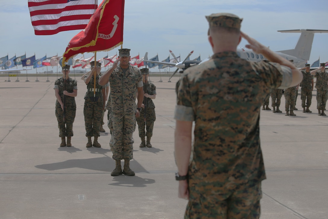 Lt. Col. Christopher Robinson, executive officer of Marine Corps Air Station (MCAS) Miramar, salutes while the national anthem plays during his retirement ceremony at MCAS Miramar, Calif., April 6. Robinson retired after serving 23 years in the Marine Corps. (U.S. Marine Corps photo by Lance Cpl. Mark A. Lowe II/Released)