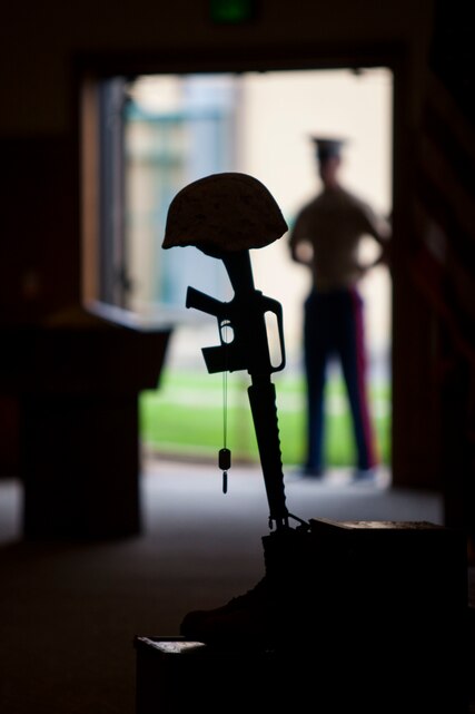 Military Battle Cross is displayed for fallen U.S. Marine