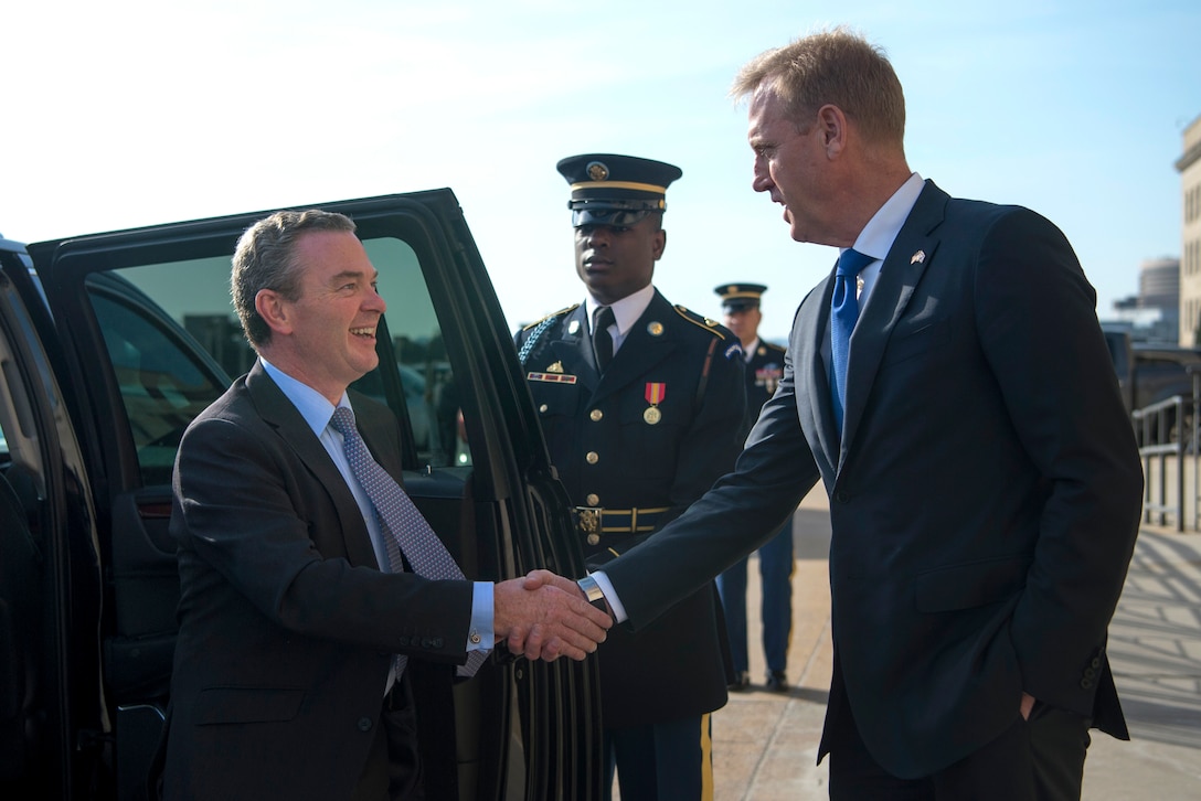 Deputy Defense Secretary Patrick M. Shanahan shakes hands with Australian Defense Industry Minister Christopher Pyne.