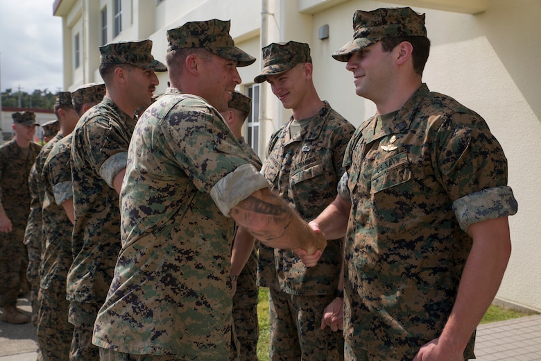 U.S. Marines with 3rd Marine Division congratulate their fellow Marines April 13, 2018, on Camp Schwab in Okinawa, Japan, for competing in the 2018 Marine Corps Forces Special Operations Command Raider Games. The service members competed in the 2018 Marine Special Operations Command Raider Games March 18-27. The four man team finished 2nd place out of nine other teams that competed.