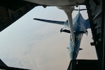 A bomber separates from the boom of another aircraft.