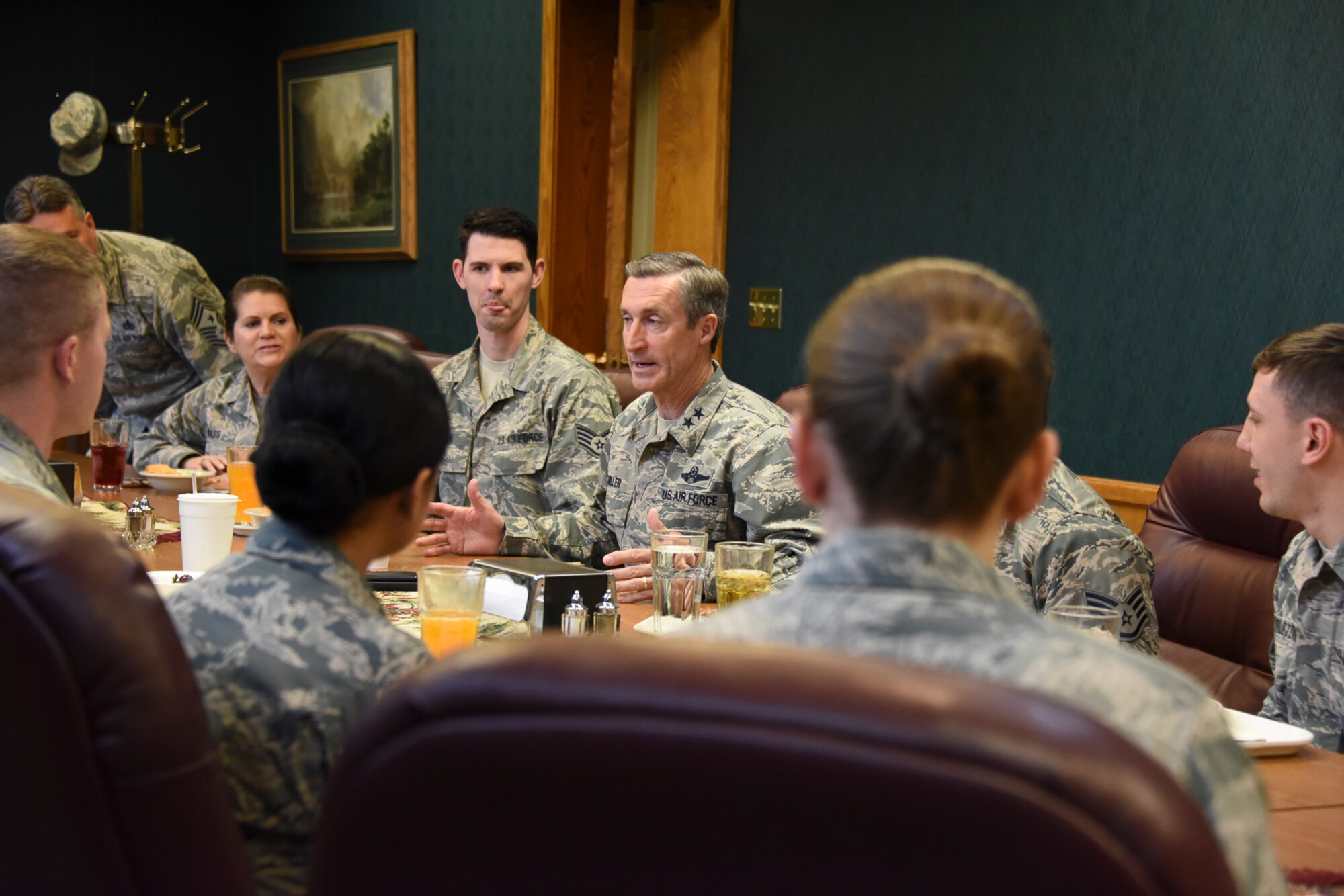 Maj. Gen. Ronald Miller (center), 10th Air Force commander, talks with Air Force reservists April 14 during his visit to the 419th Fighter Wing.
