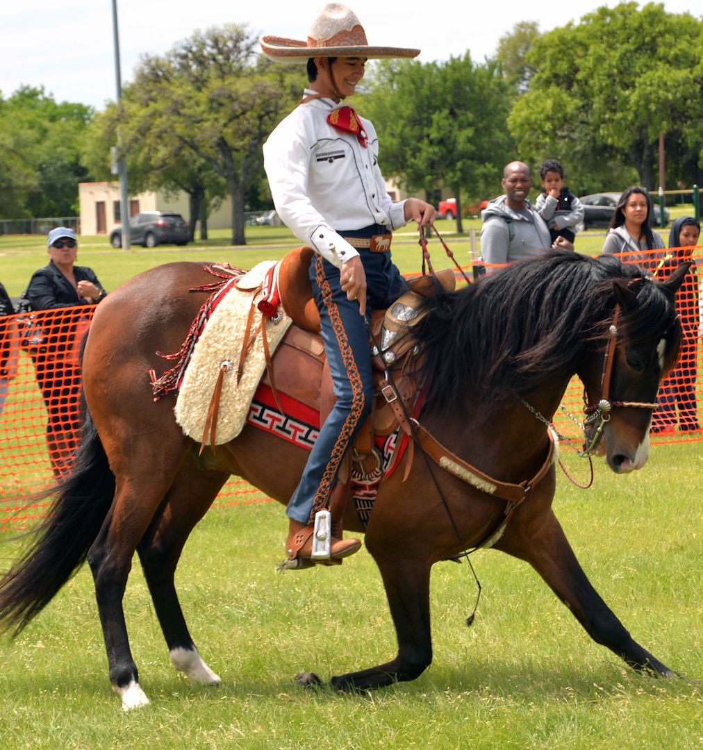 The Spanish horses and their riders entertained with their skill and precision at the annual Cowboys and Heroes event held at MacArthur Parade Field at Joint Base San Antonio-Fort Sam Houston April 14.