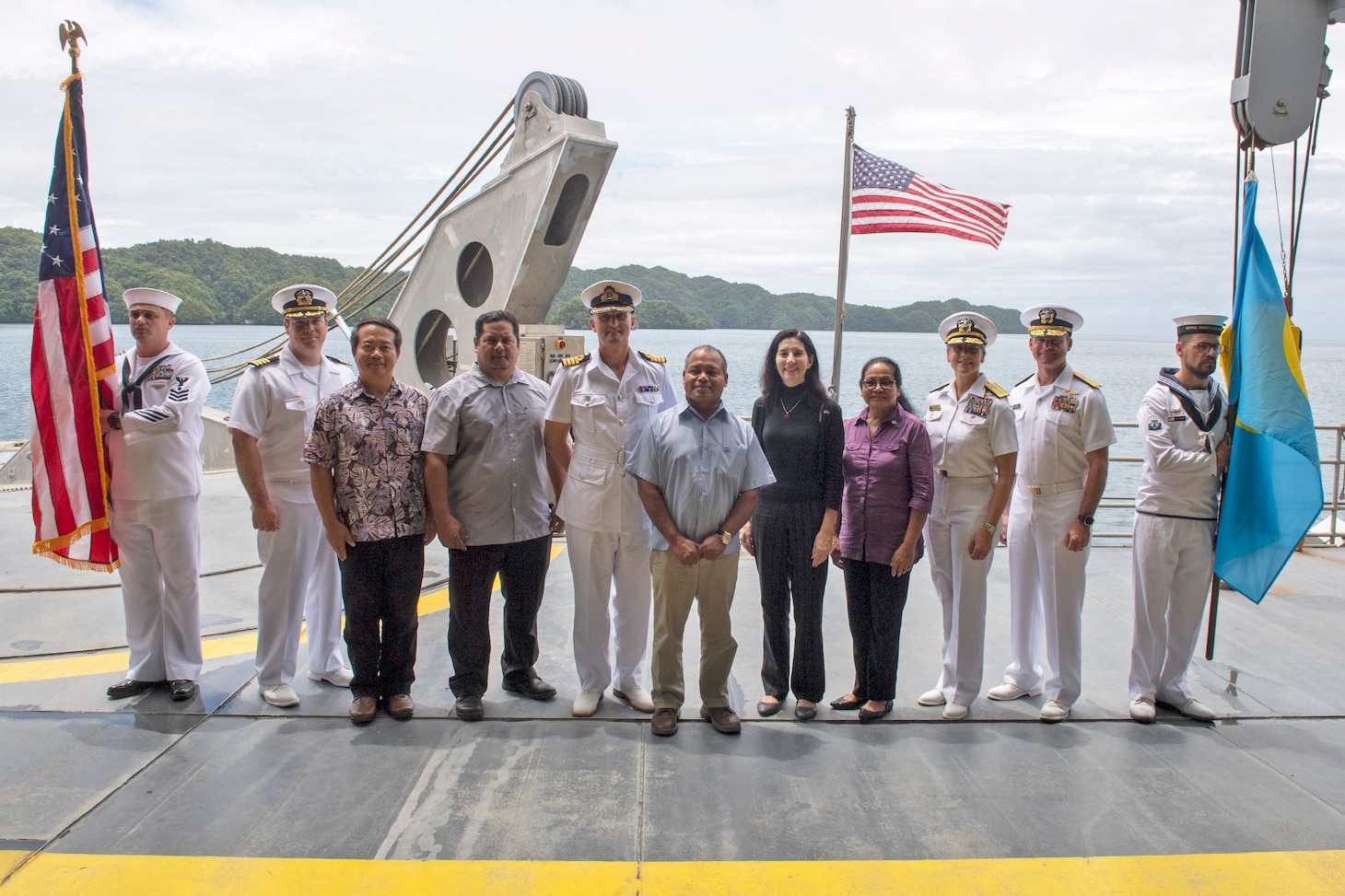 KOROR, Palau (April 14, 2018) The official party for the Pacific Partnership 2018 (PP18) Palau mission stop closing ceremony aboard Military Sealift Command expeditionary fast transport ship USNS Brunswick (T-EPF 6), stand together for a group photo at the ceremony's conclusion, April 14. PP18’s mission is to work collectively with host and partner nations to enhance regional interoperability and disaster response capabilities, increase stability and security in the region, and foster new and enduring friendships across the Indo-Pacific Region. Pacific Partnership, now in its 13th iteration, is the largest annual multinational humanitarian assistance and disaster relief preparedness mission conducted in the Indo-Pacific.