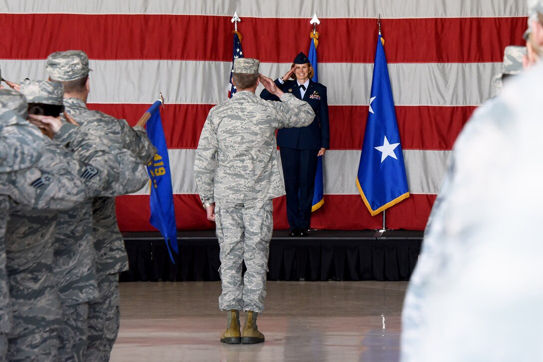 Col. Regina “Torch” Sabric renders her first salute as new commander of the 419th Fighter Wing during a ceremony April 14, 2018, at Hill Air Force Base, Utah.