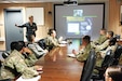 Soldiers around a table in class