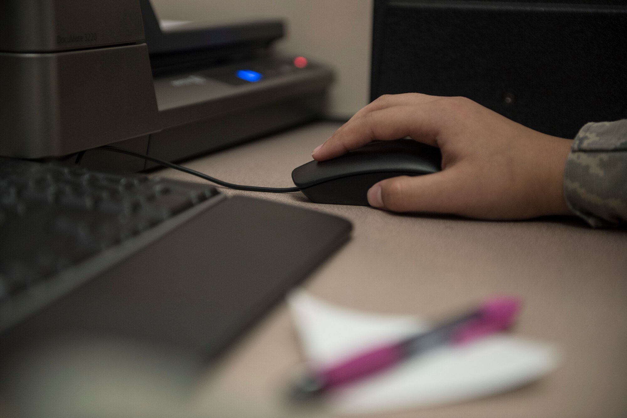U.S. Air Force Airman 1st Class Leann Munoz, 18th Force Support Squadron customer service technician, creates a new common access card for Tech. Sgt. Michael Evans, 718th Aircraft Maintenance Squadron NCOIC of computer electronic warfare, Mar. 29, 2018, at Kadena Air Base, Japan. The 18th FSS Military Personnel Section implemented a new process that enables customers to file for a dependent identification card from their cell phones or personal emails. Kadena is the 5th base to implement this new process. (U.S. Air Force photo by Staff Sgt. Micaiah Anthony)