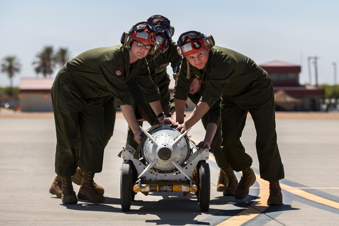 Marines transport a GBU-32 joint direct attack munition.