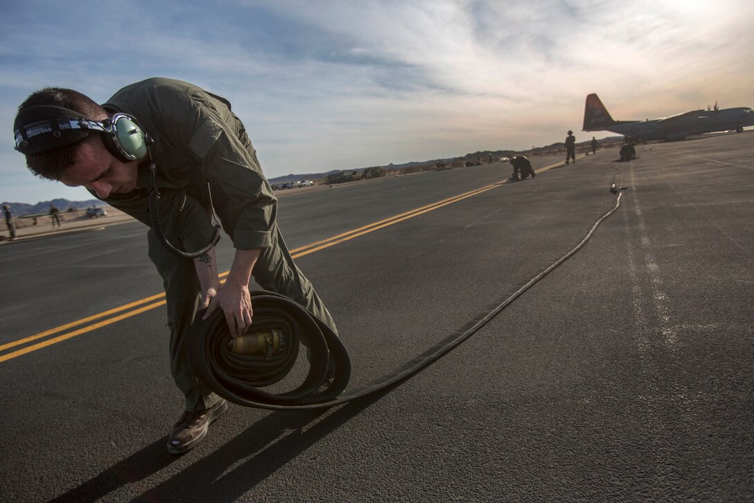 Marines prepare to refuel F-35 Lightning II aircraft.