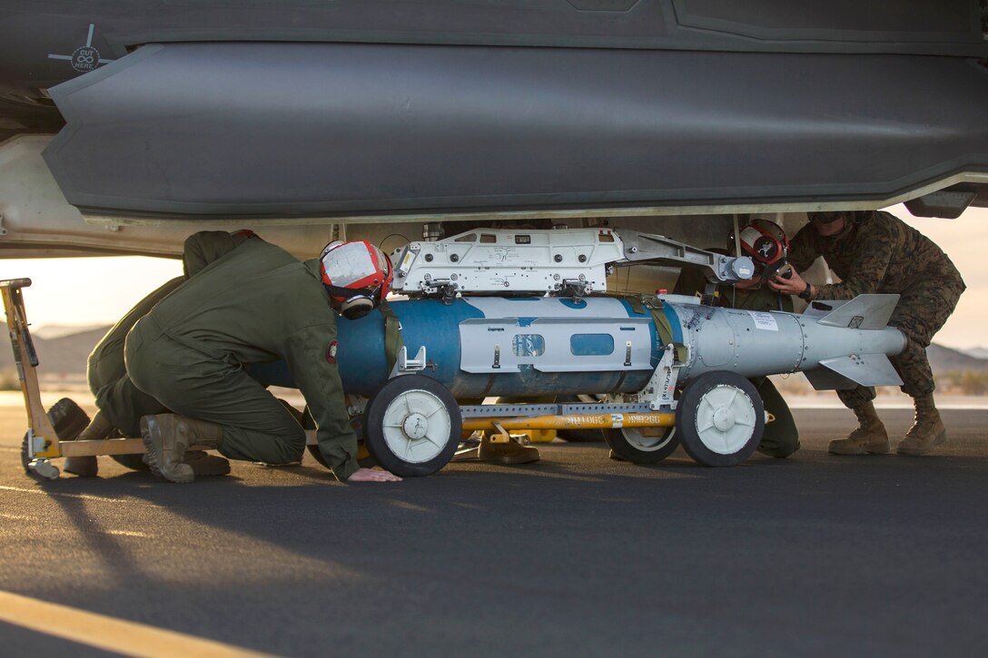 Marines load a GBU-32 joint direct attack munition.