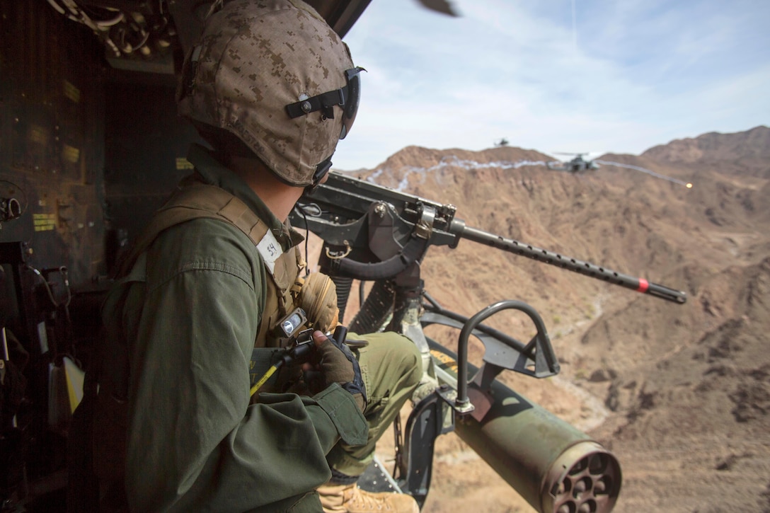 Marine UH-1Y Venom helicopters simulate gun and missile attack runs.