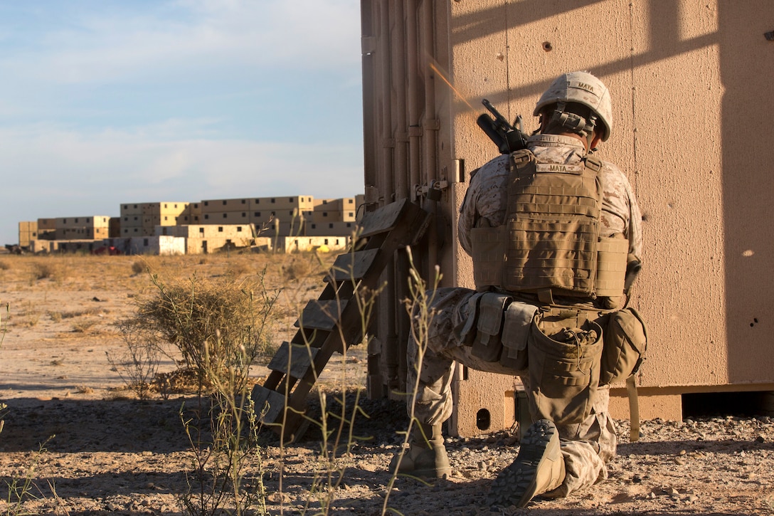 A Marine fires a M203 grenade launcher.