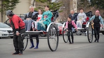 U.S. Air Force Col. Paul D Kirmis and his family, front, and Mayor Kazumasa Taneichi and wife, back, are escorted into the 31st Annual Japan Day at Misawa Air Base, Japan, April 14, 2018. These distinguished visitors held a ribbon cutting ceremony which represents the two cultures, one community concept. (U.S. Air Force photo by Airman 1st Class Collette Brooks).