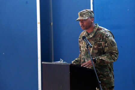 Soldier speaking at microphone