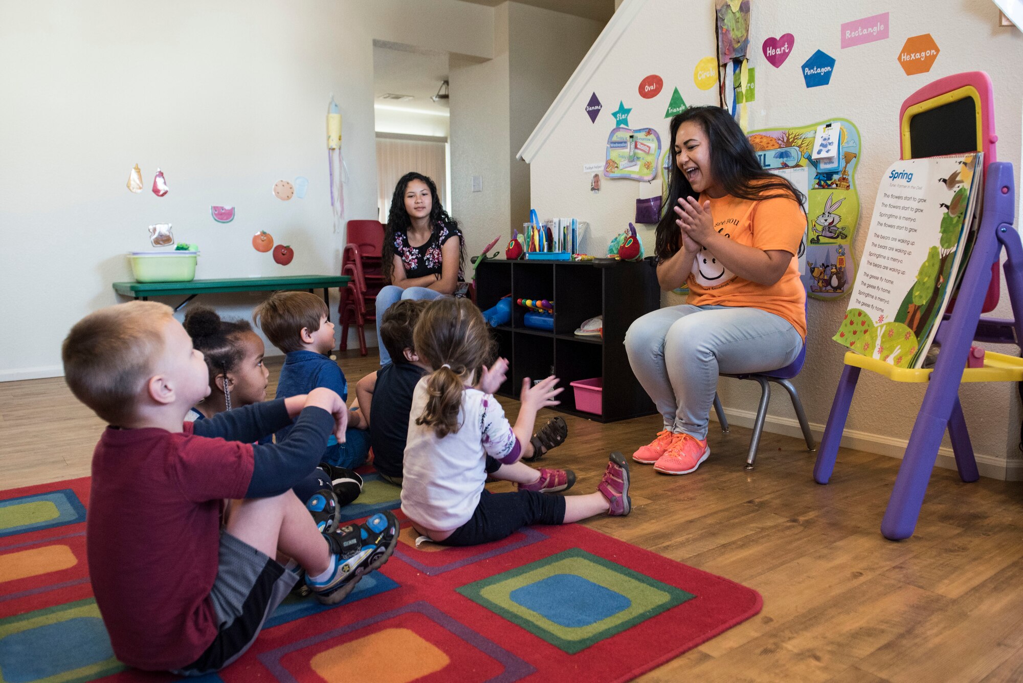 Talia Sustaita, Family Child Care (FCC) Program provider, sings songs with her children at Shaw Air Force Base, S.C., April 12, 2018.