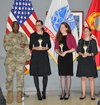 DLA Director Lt. Gen. Darrell Williams congratulates the winning team (L-R): Alison Adams, Patty Beyer and Laura Funk. Not pictured: Debra Simpson and DaToya Taylor. Photo by Teodora Mocanu.