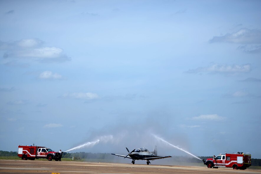 Lt. Col. Brent Green, 43rd FTS assistant director of operations, is hosed down after his fini flight April 13, 2018, on Columbus Air Force Base, Mississippi. Green, is retiring April, 13 after 28 years of service and will continue to support the Air Force and Columbus AFB in the capacities he can. (U.S. Air Force photo by Airman 1st Class Keith Holcomb)
