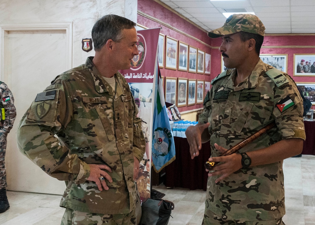 Jordan Armed Forces Sgt. Maj. Saleh Al-Othman speaks with U.S. Air Force Maj. Gen. Jon Mott, a co-director of Exercise Eager Lion 2018, during an April 15 reception following an international press conference announcing the exercise at the Jordan Special Operations Command near Amman, Jordan. Eager Lion 2018 is a major training event that provides U.S. forces and Jordan Armed Forces the opportunity to improve their collective ability to plan and operate in a coalition-type environment through scenarios that span from a long-range bomber mission to maritime security operations to a ground force attack of a fictitious adversary. It is scheduled to take place through April 26. (U.S. Army photo by Sgt. 1st Class Patrick J. DeGeorge, 139th Mobile Public Affairs Detachment)