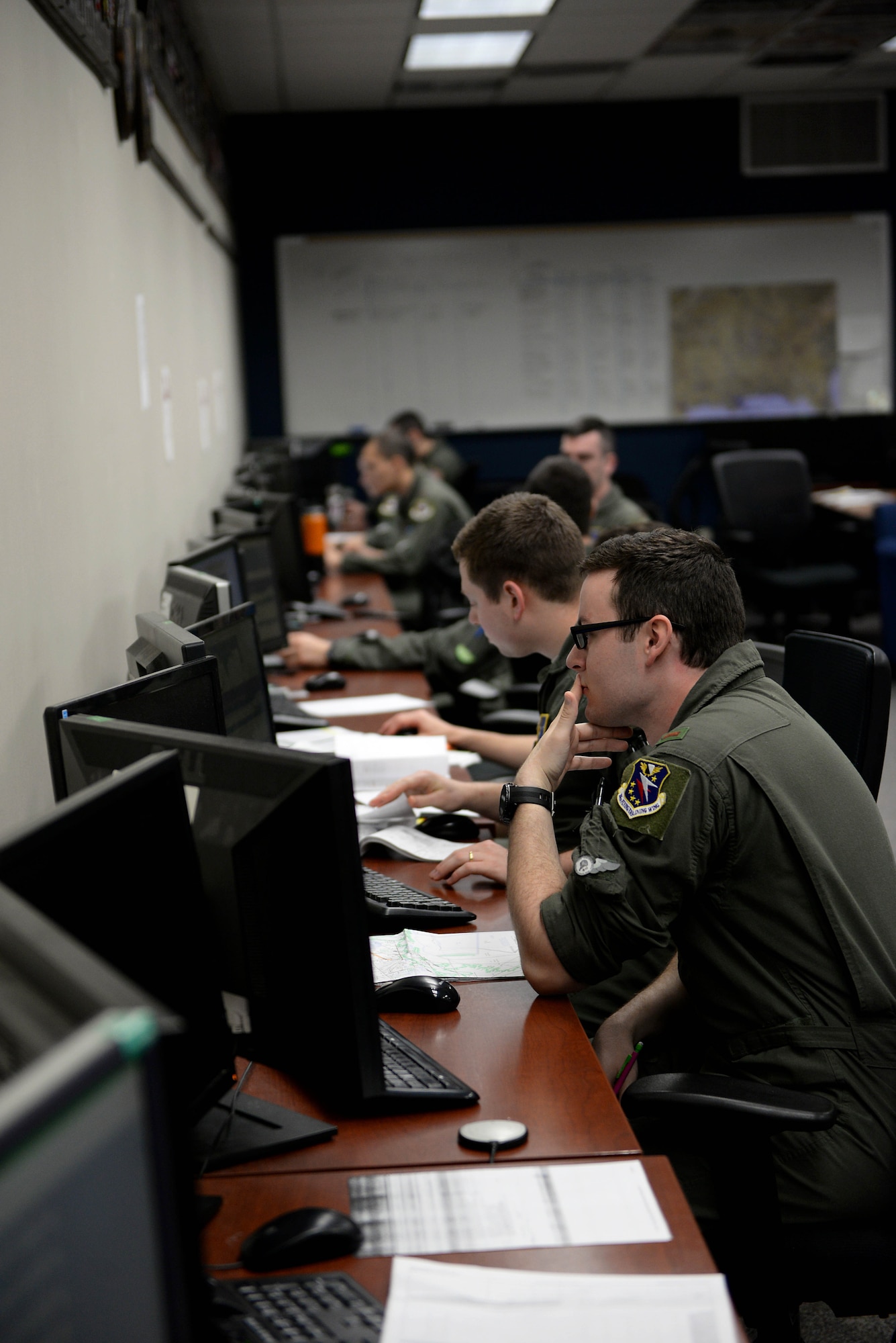 Student pilots in the 48th Flying Training Squadrons study for and plan their next flight April 10, 2018, on Columbus Air Force Base, Mississippi. Students throughout pilot training study often to keep up with the demanding syllabus. (U.S. Air Force photo by Airman 1st Class Keith Holcomb)