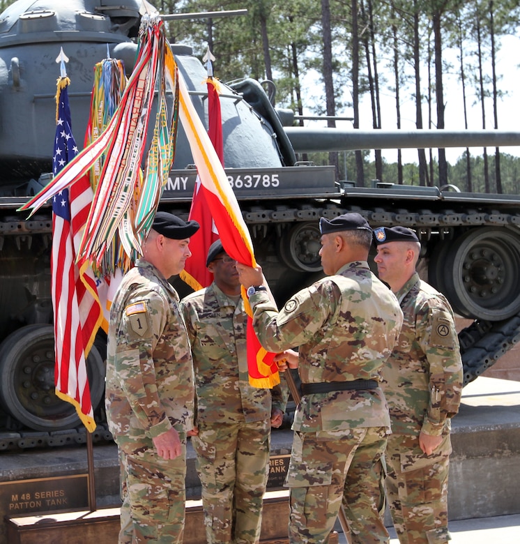 Lt. Gen. Michael X. Garrett (center), the U.S. Army Central commander, passes the colors to Command Sgt. Maj. Joseph C. Cornelison, the new USARCENT senior enlisted advisor, during a change of responsibility ceremony Nov. 12 at Patton Hall. The passing of the colors symbolizes Garrett’s entrusting of Cornelison with the well-being of the Soldiers and the enforcement of standards across the command. Cornelison assumed responsibility from Command Sgt. Maj. Eric C. Dostie (right), who will become the next senior enlisted advisor to the U.S. Army Combined Arms Center at Fort Leavenworth, Kansas.