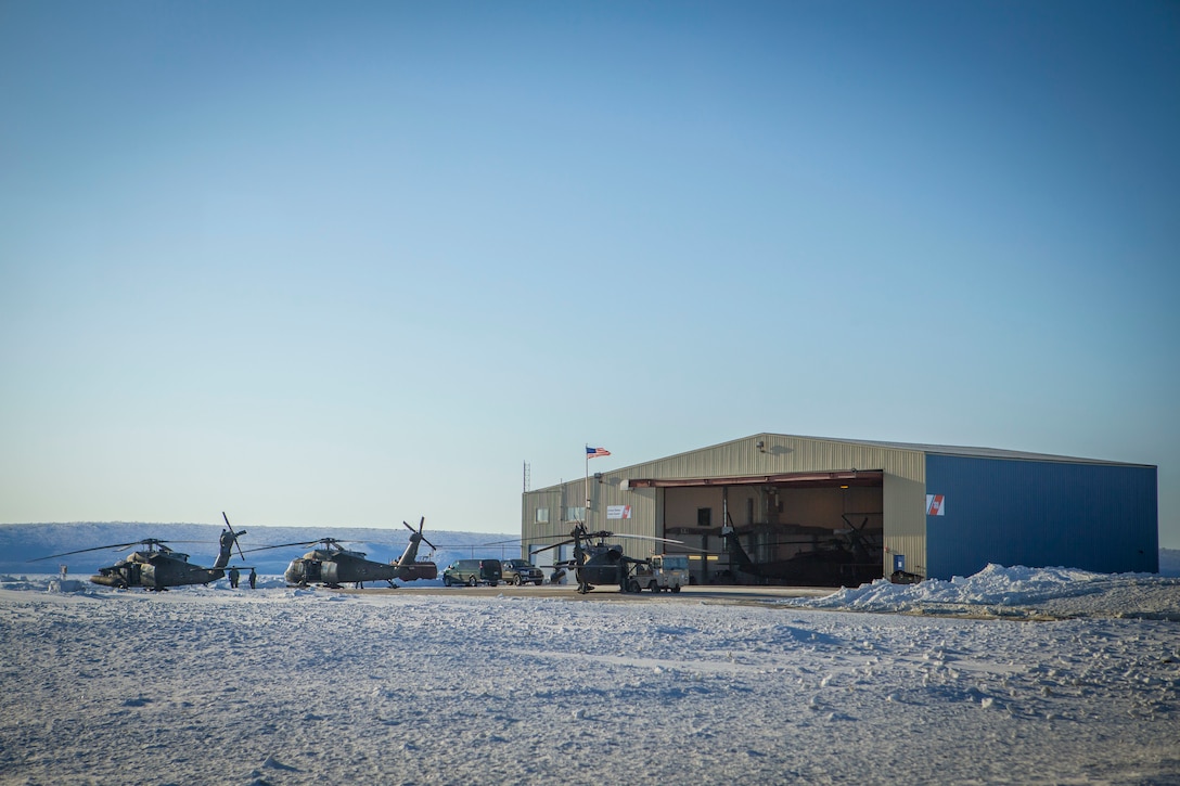 Several U.S. Army UH-60 Black Hawk helicopters are staged prior to being loaded with gear and supplies to depart Kotzebue, Alaska, and travel to outlying villages, April 14, 2018.