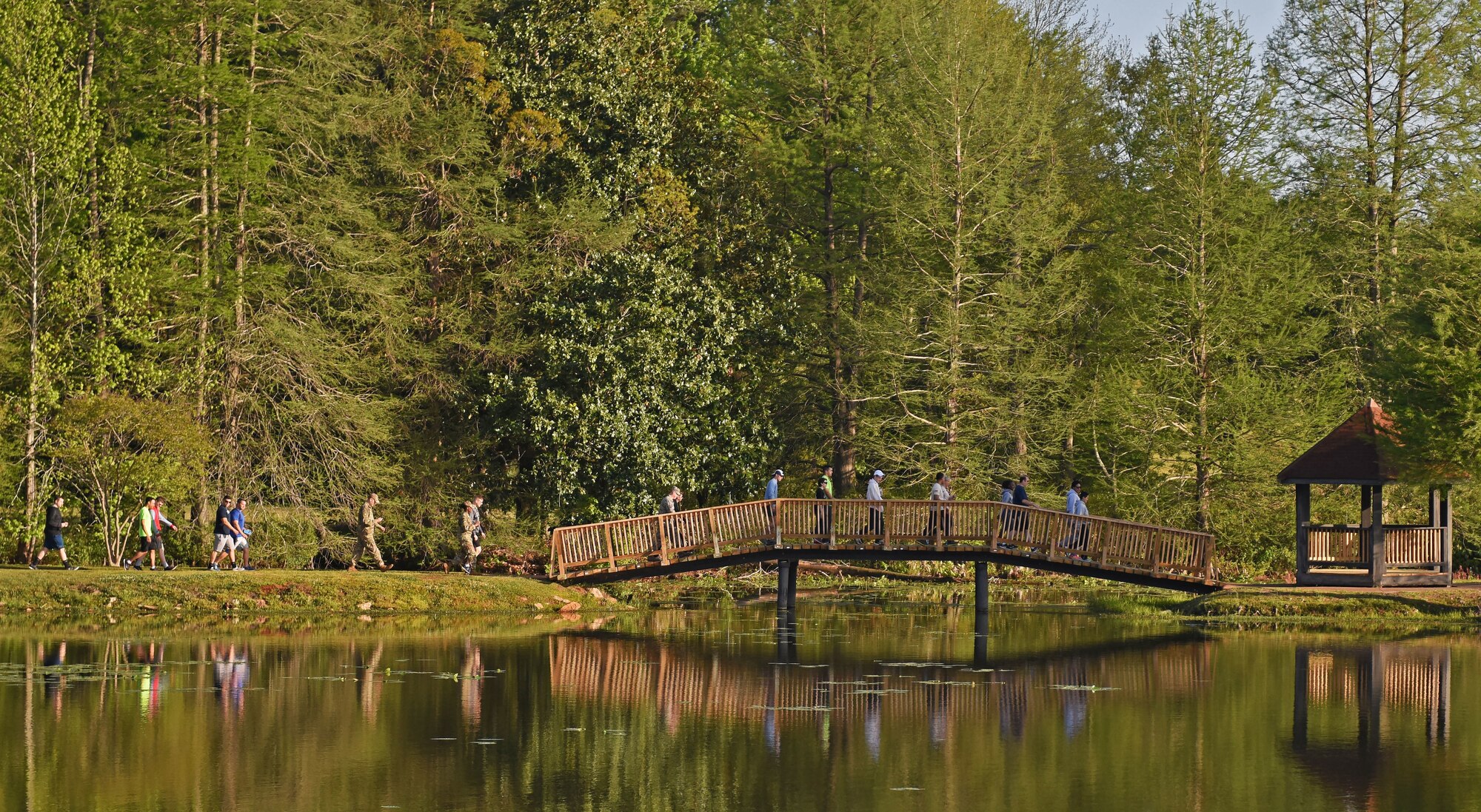 Team Shaw members walk around Memorial Lake to raise money for the Air Force Assistance Fund during a Weasel Walk at Shaw Air Force Base, S.C., April 13, 2018.