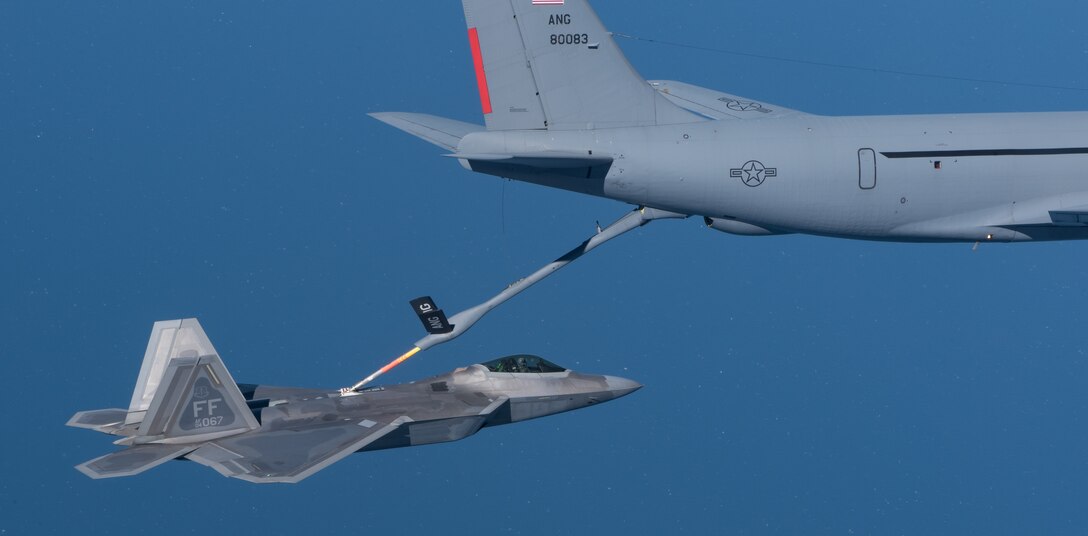 A KC-135 Stratotanker from the 121st Air Refueling Wing refuels an F-22 Raptor from the 1st Fighter Wing over the Atlantic Ocean, April 12, 2018. The 1st Fighter Wing is home to the 94th Fighter Squadron and 27th Fighter Squadron at Joint Base Langley-Eustis, Va. and the 121st ARW is from Rickenbacker Air National Guard Base, Ohio. (U.S. Air Force photo by Staff Sgt. Carlin Leslie)