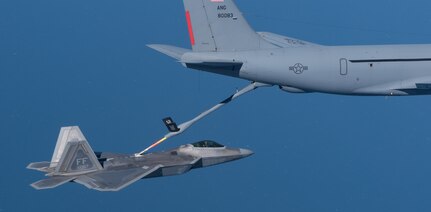 A KC-135 Stratotanker from the 121st Air Refueling Wing refuels an F-22 Raptor from the 1st Fighter Wing over the Atlantic Ocean, April 12, 2018. The 1st Fighter Wing is home to the 94th Fighter Squadron and 27th Fighter Squadron at Joint Base Langley-Eustis, Va. and the 121st ARW is from Rickenbacker Air National Guard Base, Ohio. (U.S. Air Force photo by Staff Sgt. Carlin Leslie)