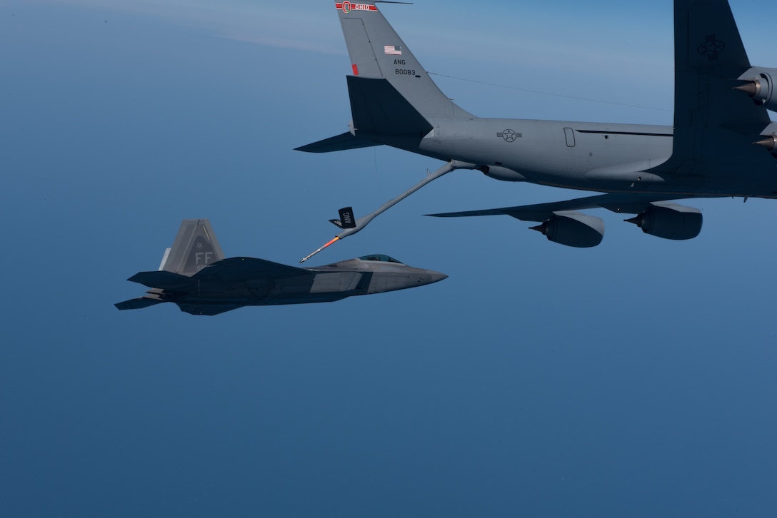 A KC-135 Stratotanker from the 121st Air Refueling Wing refuels an F-22 Raptor from the 1st Fighter Wing over the Atlantic Ocean, April 12, 2018. The 1st Fighter Wing is home to the 94th Fighter Squadron and 27th Fighter Squadron at Joint Base Langley-Eustis, Va. and the 121st ARW is from Rickenbacker Air National Guard Base, Ohio. (U.S. Air Force photo by Staff Sgt. Carlin Leslie)