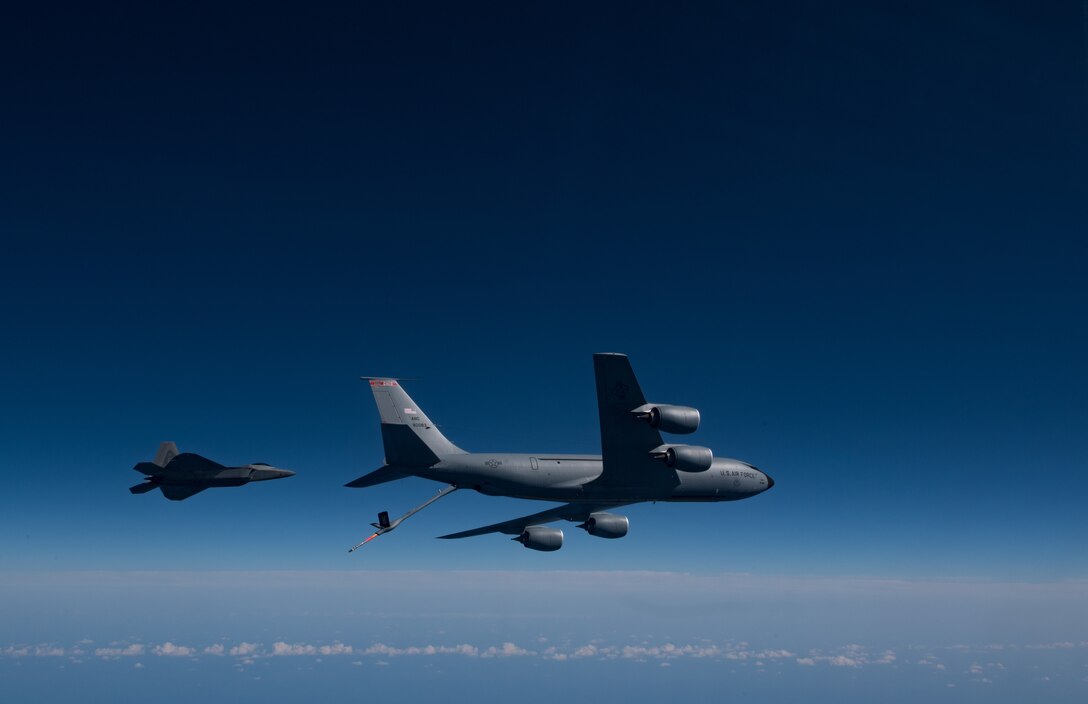 A KC-135 Stratotanker from the 121st Air Refueling Wing refuels an F-22 Raptor from the 1st Fighter Wing over the Atlantic Ocean, April 12, 2018. The 1st Fighter Wing is home to the 94th Fighter Squadron and 27th Fighter Squadron at Joint Base Langley-Eustis, Va. and the 121st ARW is from Rickenbacker Air National Guard Base, Ohio. (U.S. Air Force photo by Staff Sgt. Carlin Leslie)