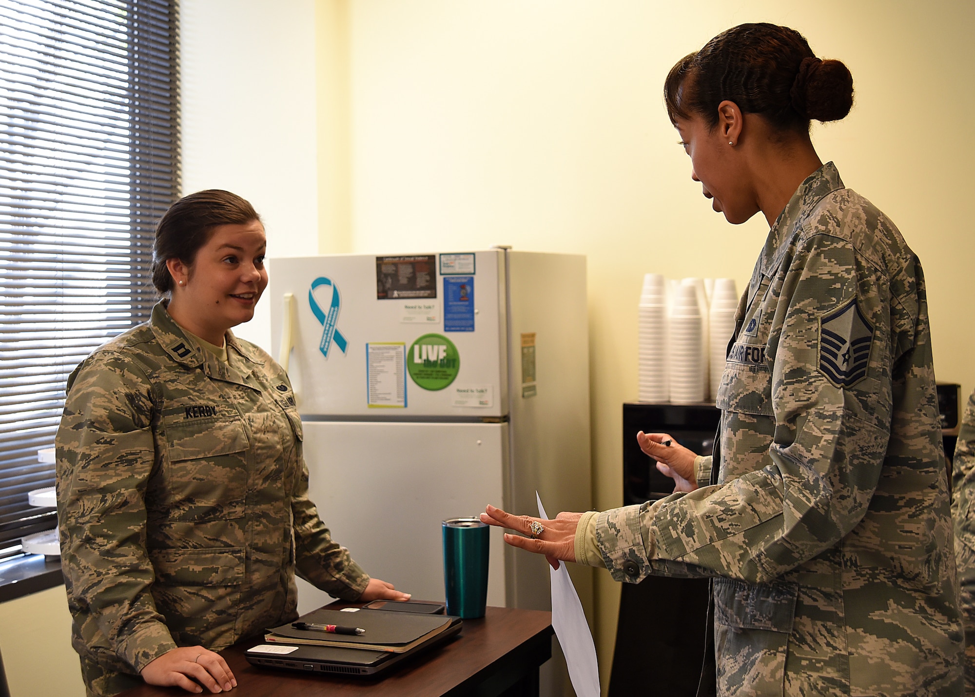 U.S. Air Force Capt. Lauren Kerby, 628th Air Base Wing Special Victims’ Counsel, left, speaks with Master Sgt. Tanya Wyatt, 20th Fighter Wing Equal Opportunity superintendent, during a Sexual Assault Prevention and Response office open house at Shaw Air Force Base, S.C., April 12, 2018.