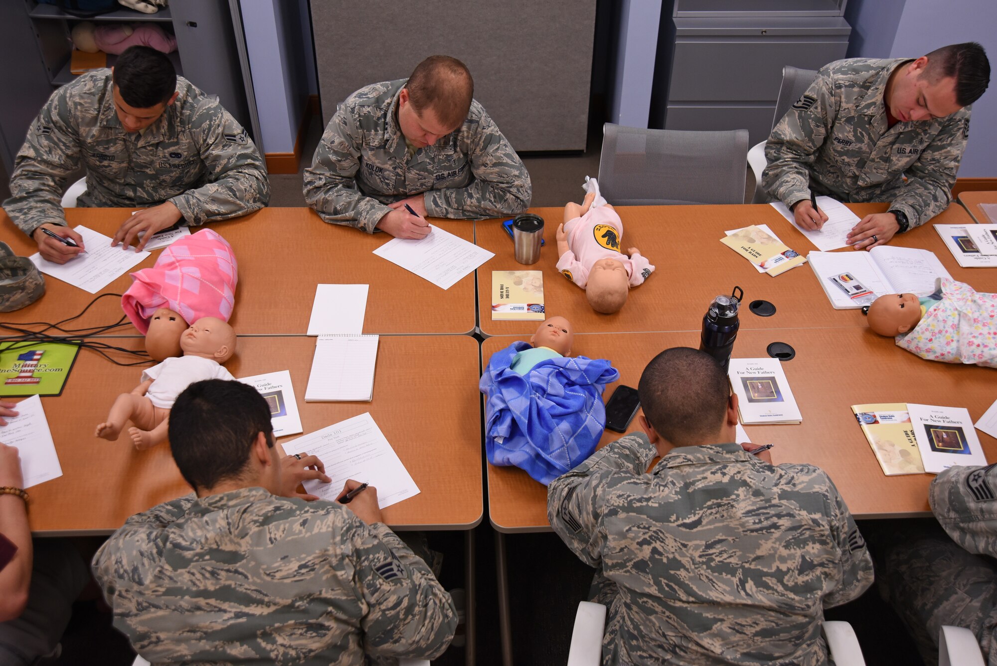 U.S. Airmen complete a pre-test during a Dad’s 101 class at Shaw Air Force Base, S.C., April 13, 2018.