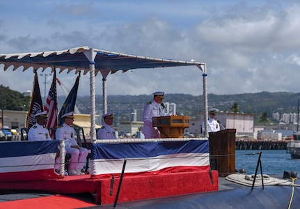 Cmdr. Jacob A. Foret, commanding officer of the Los Angeles-class fast-attack submarine USS Santa Fe (SSN 763), addresses guests during a change of command ceremony on the submarine piers in Joint Base Pearl Harbor-Hickam, April 13.