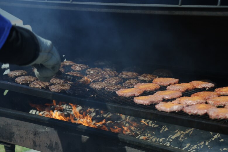 CAMP FOSTER, OKINAWA, Japan – Burgers are being grilled during the Kubasaki High School Month of the Military Child barbecue April 10 aboard Camp Foster, Okinawa, Japan.