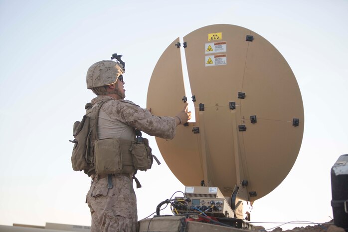 U.S. Marine Corps Cpl. Anthony Salas, a network administrator with the 15th Marine Expeditionary Unit, installs a Hawkeye III Satellite in Iraq, Dec., 4, 2017. The communications team was deployed in support of the 15th MEU’s aviation combat element conducting missions in support of Combined Joint Task Force Operation Inherent Resolve.
