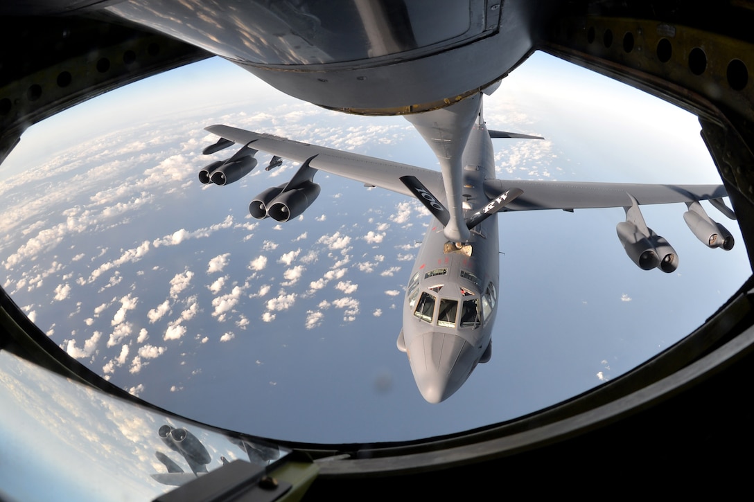 A B-52 Stratofortress gets refueled in flight.