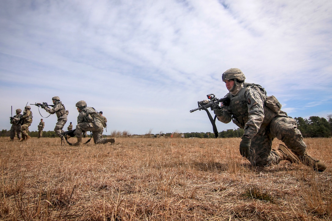 Soldiers rush toward their follow-on objective.