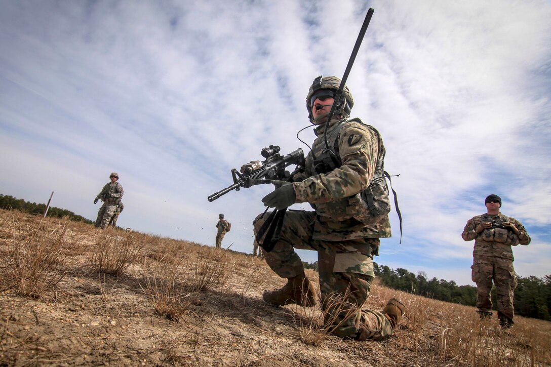 A soldier communicates with his headquarters’ leadership team.