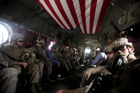 U.S. Marines with Task Force Southwest (TFSW) ride aboard a CH-47 Chinook after a security shura at the police headquarters in Lashkar Gah, Afghanistan, March 27, 2018. The meeting allowed Marine advisors with TFSW to build rapport with their counterparts to further the train, advise, assist mission in preparation for Operation Nasrat I in Helmand Province. (U.S. Marine Corps photo by Sgt. Sean J. Berry)