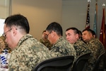 MacDill AFB, Fla. (April 12, 2018) – Members of an Uzbekistan military delegation meet with U.S. military officers at U.S. Central Command headquarters to discuss military-to-military activities. The annual talks are intended to deepen U.S. - Uzbekistan military cooperation, and advance mutual security and defense interests. (Photo by Tom Gagnier)