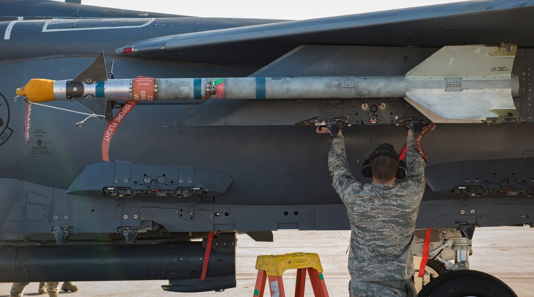 Staff Sgt. Dustin Machen, 389th Aircraft Maintenance Unit weapons loader from Moutain Home Air Force Base, Idaho, performing final checks on an F-15 Eagle fighter jet during a load crew competition at Nellis Air Force Base, Nevada, April 13, 2018. Load crew competitions provide weapons loaders the opportunity to display their weapons loading skills to their peers and superiors.(U.S. Air Force photo by Airman 1st Class Andrew D. Sarver)