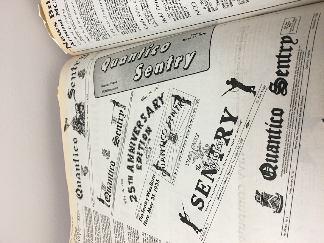The logo of the Quantico Sentry (called the flag in the newspaper business) was redesigned numerous times and the different renditions are depicted here in the 25th anniversary edition of the paper.
