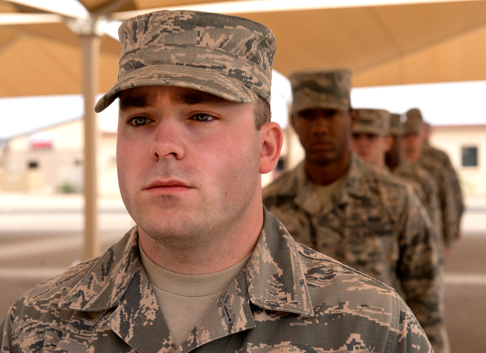 Local Honor Guard Airmen stand in line during a formation practice under the direction of instructors from the U.S. Air Force’s official Honor Guard team April 16, 2018, at Luke Air Force Base, Ariz. Members of the Air Force Honor Guard team came to Luke to train local Honor Guard members on special techniques, formations, and demonstrations. (U.S. Air Force photos by Senior Airman Ridge Shan)