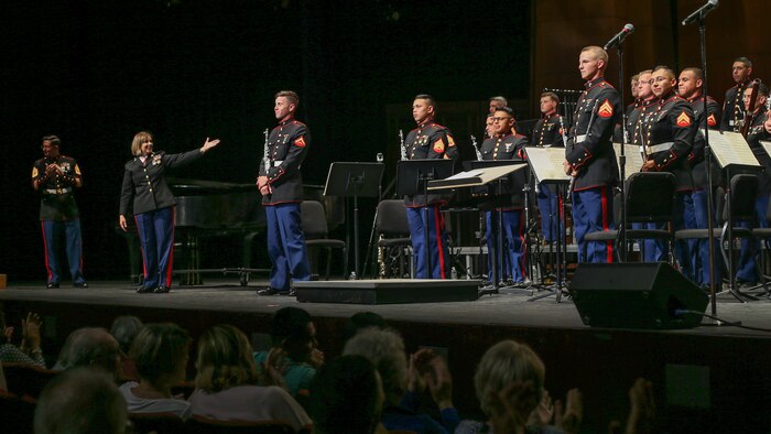 U.S. Marines with the 1st Marine Division Band, stand after a performance during the 1st Marine Division Band’s 10th annual concert at the California Center for the Arts, Escondido, Calif., March 29, 2018.