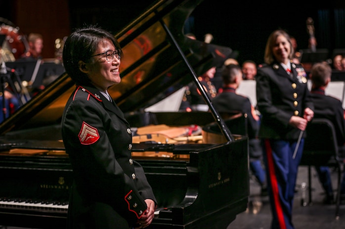 U.S. Marine Corps Cpl. Seungyen Shin, a musician keyboardist for 1st Marine Division Band, stands after performing “Rhapsody in Blue” during the 1st Marine Division Band’s 10th annual concert at the California Center for the Arts, Escondido, Calif., March 29, 2018.