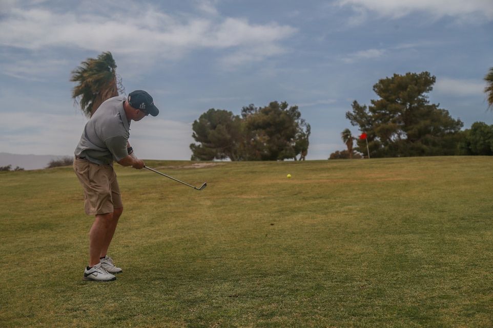 Col. Jason Beaudoin, commanding officer, Marine Corps Logistics Operations Group, chips onto the green at the first-ever True Grit Tournament at the Desert Winds Golf Course aboard the Marine Corps Air Ground Combat Center, Twentynine Palms, Calif., April 6, 2018. The tournament was held to raise money for MCLOG’s Marine Corps Birthday Ball while also building relations between the host unit and other units on base. (U.S. Marine Corps photo by Lance Cpl. Preston L. Morris)
