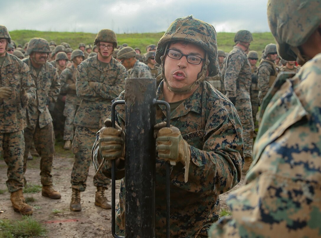 U.S. Marine Corps Cpl. Rafael Govea, a combat engineer, with Marine Wing Support Squadron (MWSS) 372, Marine Aircraft Group 39, 3rd Marine Aircraft Wing, stake a metal rod into the dirt during a St. Patrick’s Day field meet hosted by 1st Combat Engineer Battalion (CEB), 1st Marine Division at Marine Corps Base Camp Pendleton, Calif., March 23, 2018