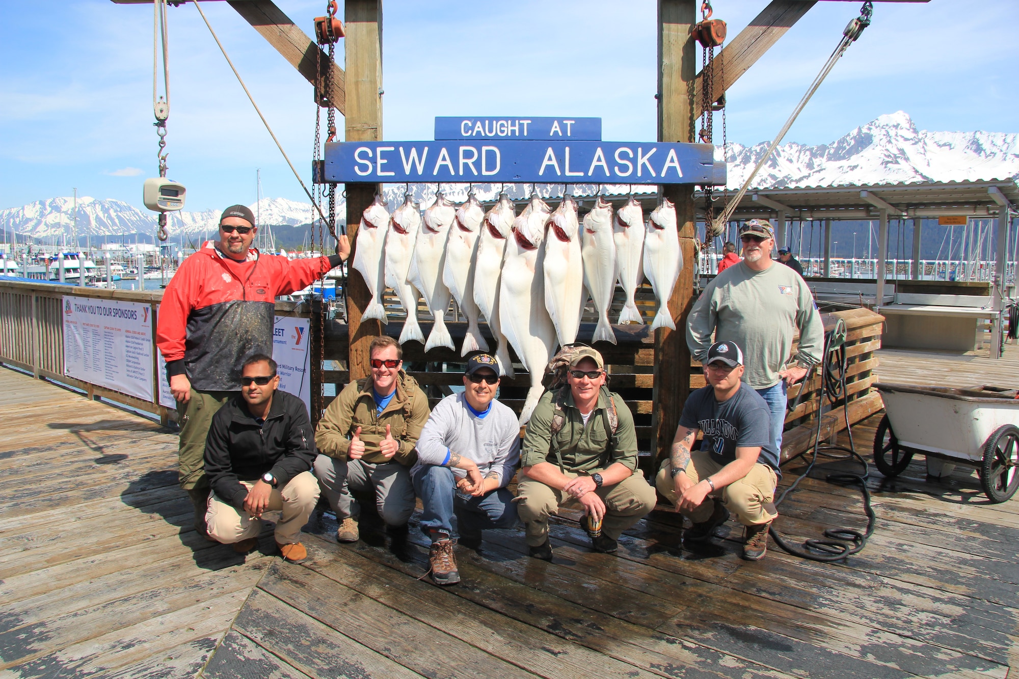 Participants of the 2016 Armed Services YMCA of Alaska Combat Fishing Tournament, pose for a group photo with the day’s catch in Seward, Alaska, May 26, 2016. Founded in 2006, the ASYMCA of Alaska Combat Fishing Tournament was established as a way of showing thanks and honor to service members through an opportunity to go deep-sea fishing.